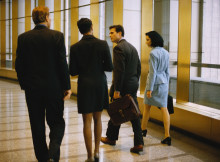 Business People Walking by Window