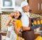 asian-couple-baking-muffins-home-kitchen_79405-8444