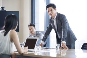 focused_178413164-stock-photo-asian-business-people-talking-meeting