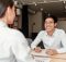young-asian-businessman-job-interview-with-woman-office_97712-242