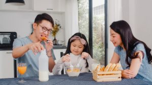 asian-japanese-family-has-breakfast-home-asian-mom-dad-daughter-feeling-happy-talking-together-while-eat-bread-corn-flakes-cereal-milk-bowl-table-kitchen-morning_7861-2247